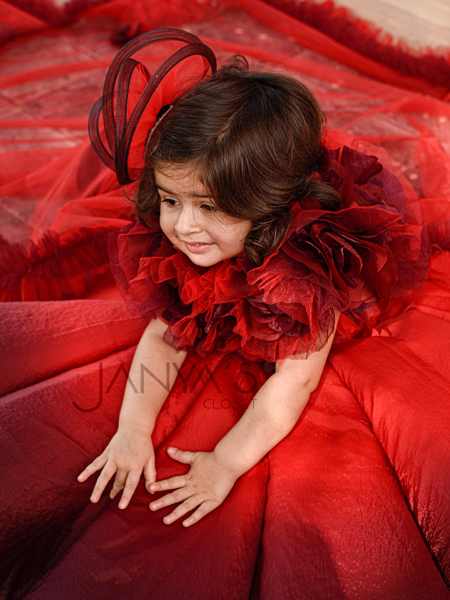 Shaded Red Couture Gown With Hair Accessory